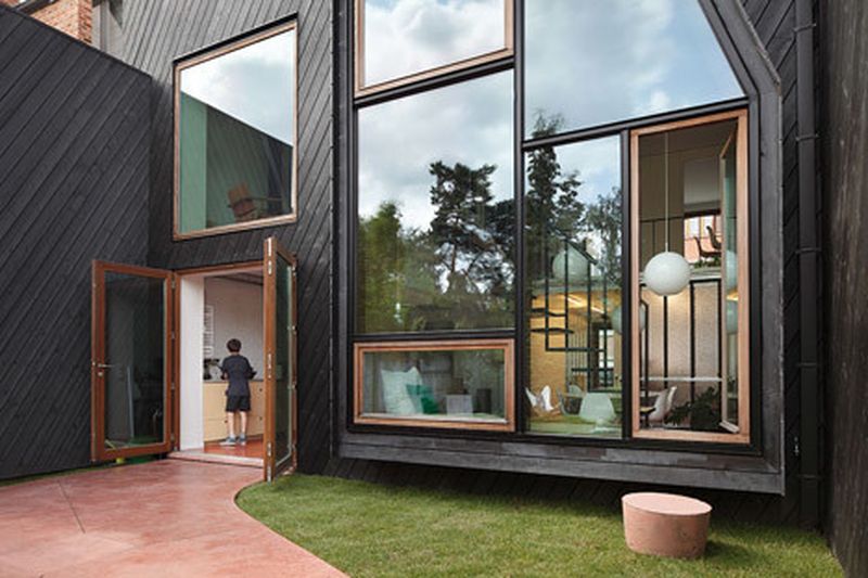 image: Assorted windows and diagonal cladding feature on re... by waryamaranth