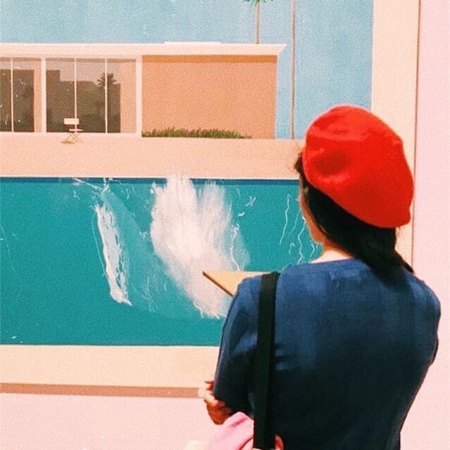image: "A Bigger Splash" shows a typical California day – warm and sunny, with a cloudless blue sky. In the background, two palm trees loom over a large single-story house, with flat roof and large sliding glass doors, in front of which an empty director's... by cocodavez